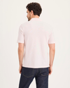 Back view of model wearing Calcite Pique Polo, Slim Fit.