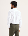 Back view of model wearing Lucent White Signature Shirt Long Sleeve with Stain Defender®, Slim Fit.