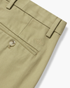 View of model wearing New British Khaki Signature Iron Free Khakis, Skinny Fit with Stain Defender®.