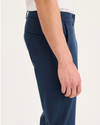 Side view of model wearing Ocean Blue Go Activeflex Chino, Skinny Fit.